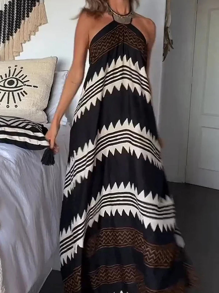 Vestido resort con vuelo y estampado con cuello halter