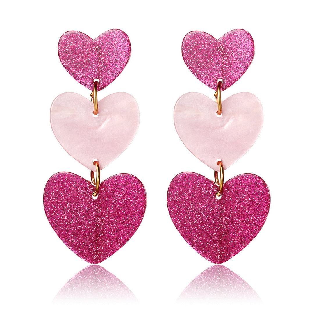 Boucle d'oreille triple expression coeur