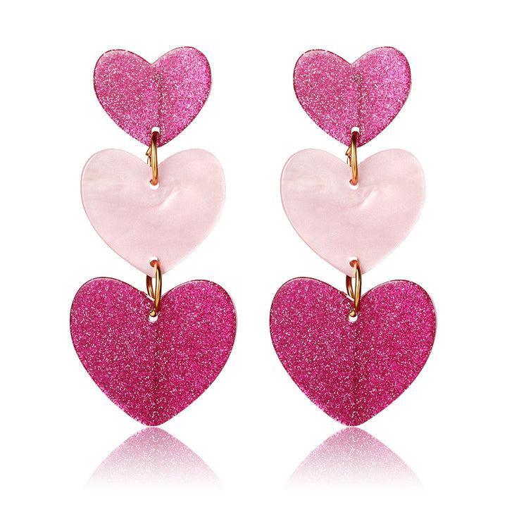 Boucle d'oreille triple expression coeur