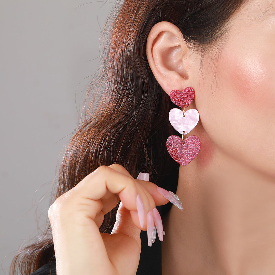 Boucle d'oreille triple expression coeur