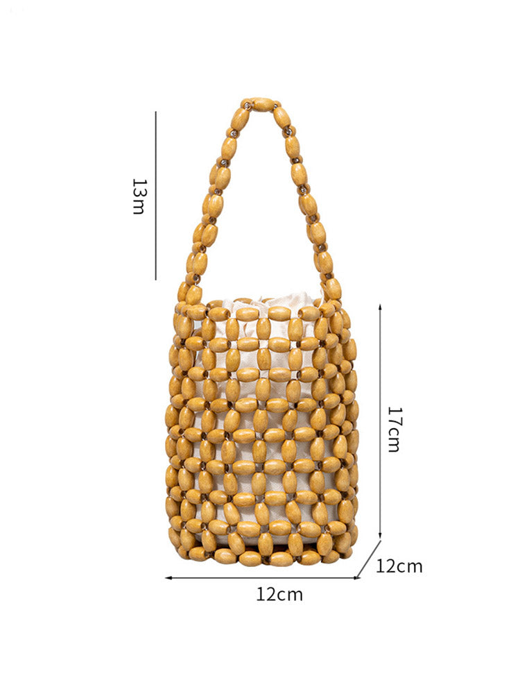 Uitgeholde houten kraal geweven emmertas