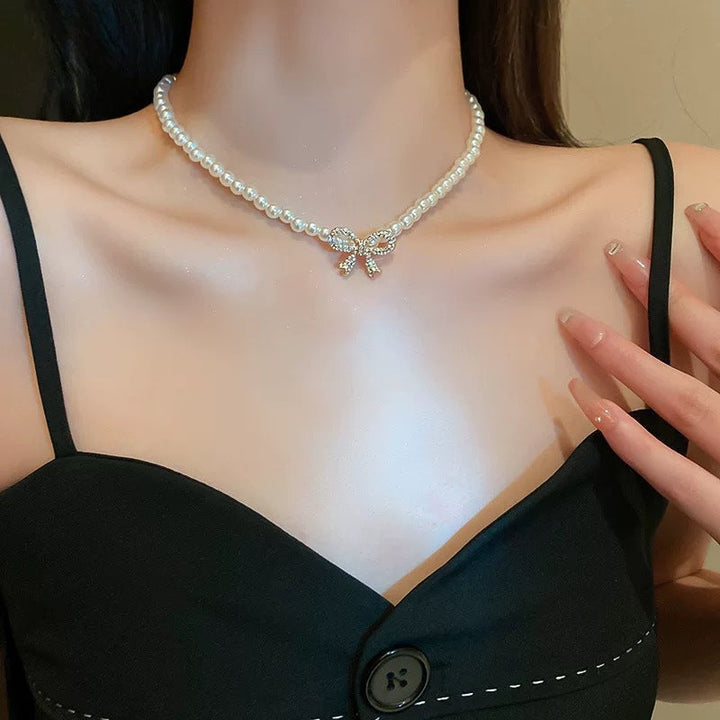 Perle sløyfe halskjede