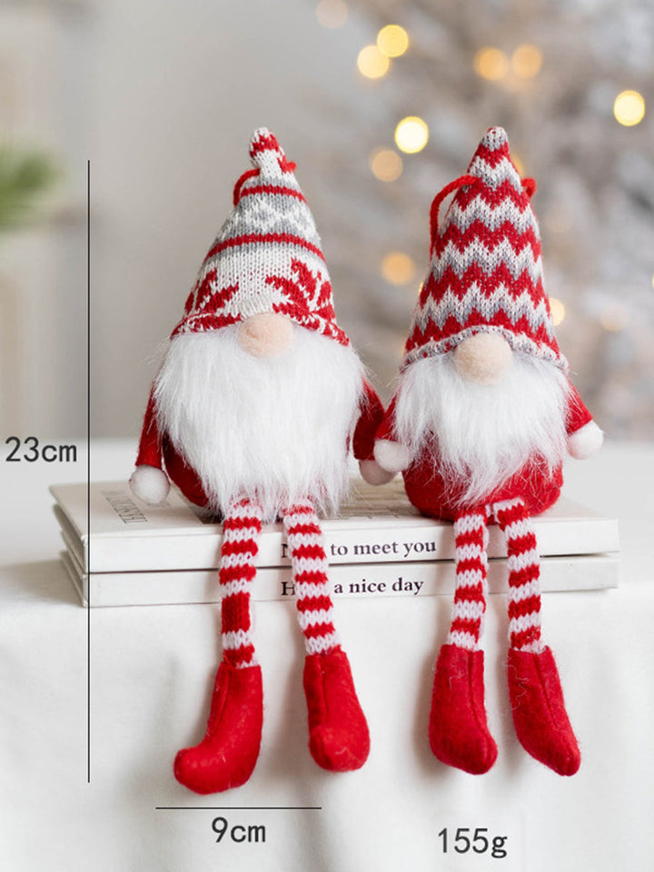 Un paio di bambole in tessuto peluche di Babbo Natale, pendenti di Babbo Natale