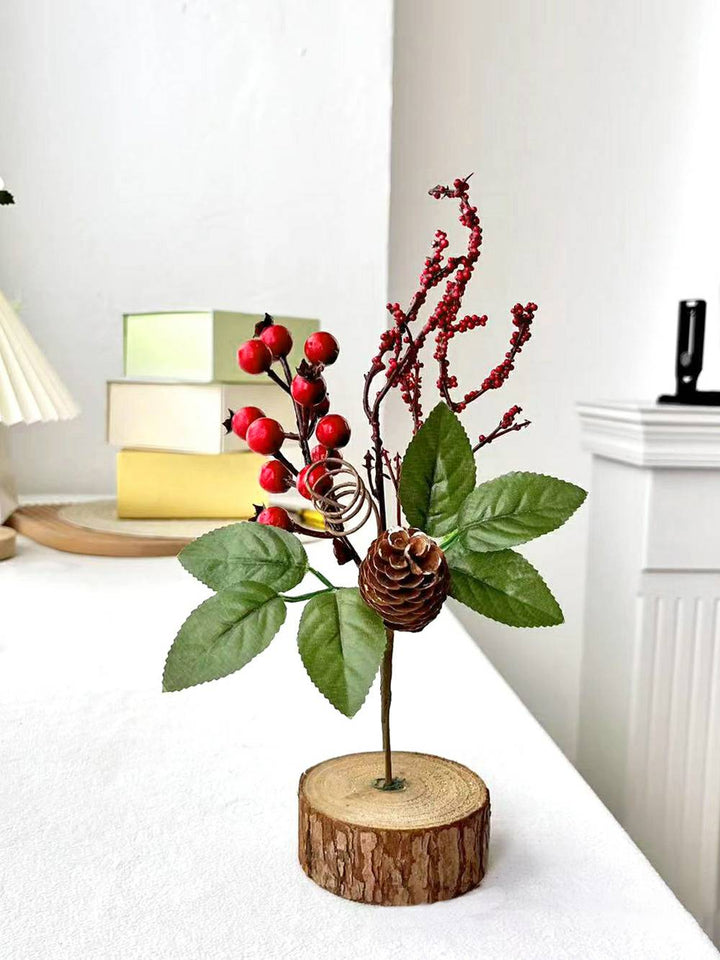 Gałęzie szyszki sosnowej z czerwonej jagody i kokardką z dekoracją choinkową