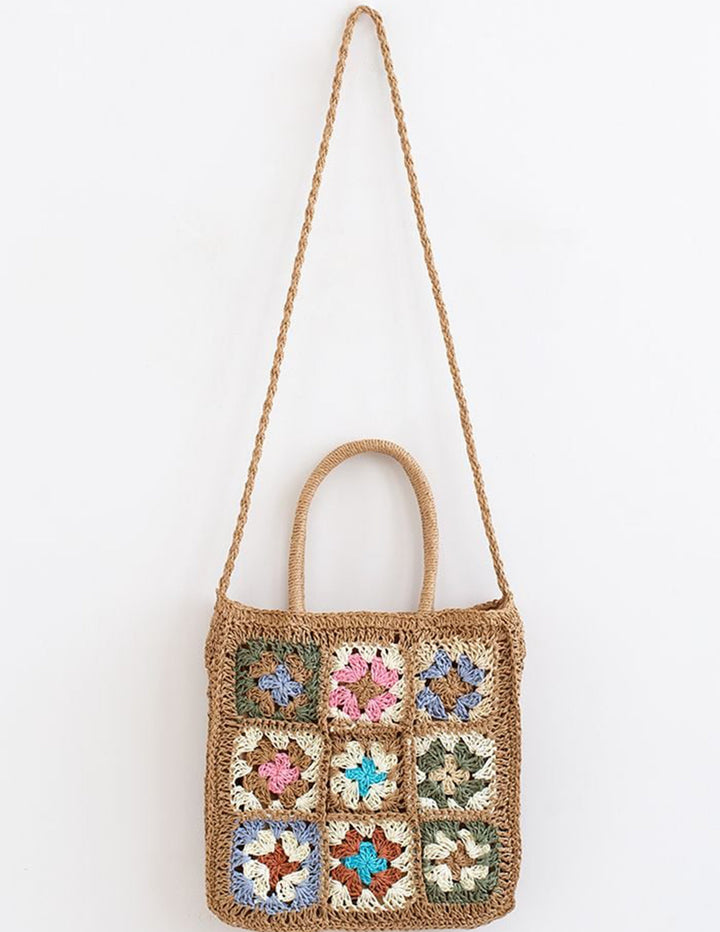 Bolsa de palha tecida com flores coloridas