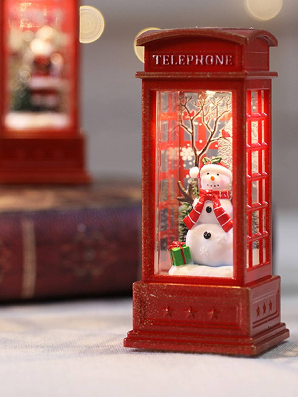 Cabina telefónica navideña Lámpara de aceite Muñeco de nieve Decoración de llama