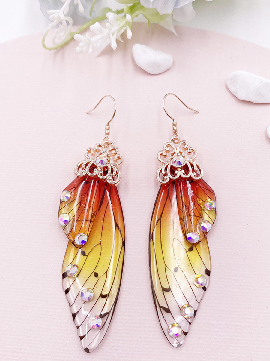 Pendientes de cristal de ala de cigarra con diamantes de imitación amarillos con ala de mariposa