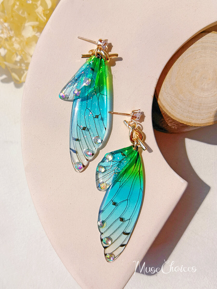 Boucle d'oreille asymétrique aile de papillon, cristal et diamant