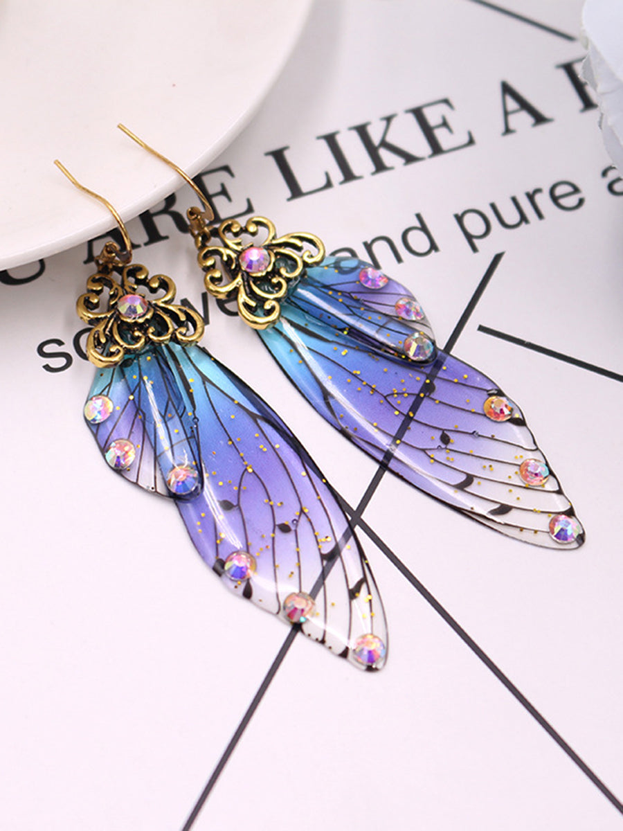 Kolczyki z kryształowymi skrzydłami motyla i niebieskimi kryształami Cykada