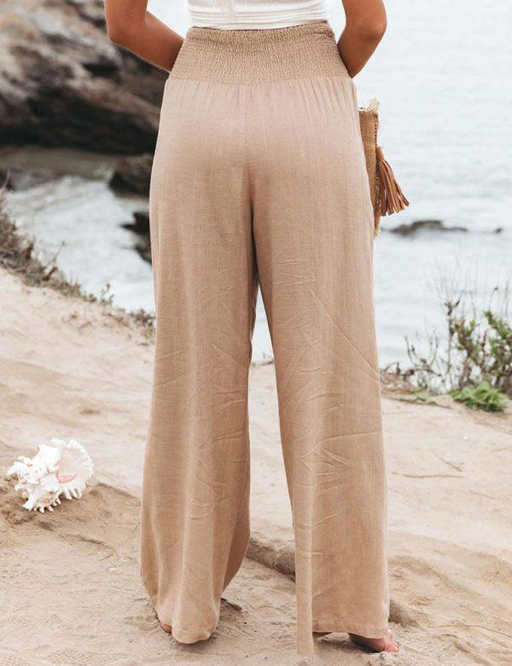 Pantalon large en lin à taille smockée et coutures latérales