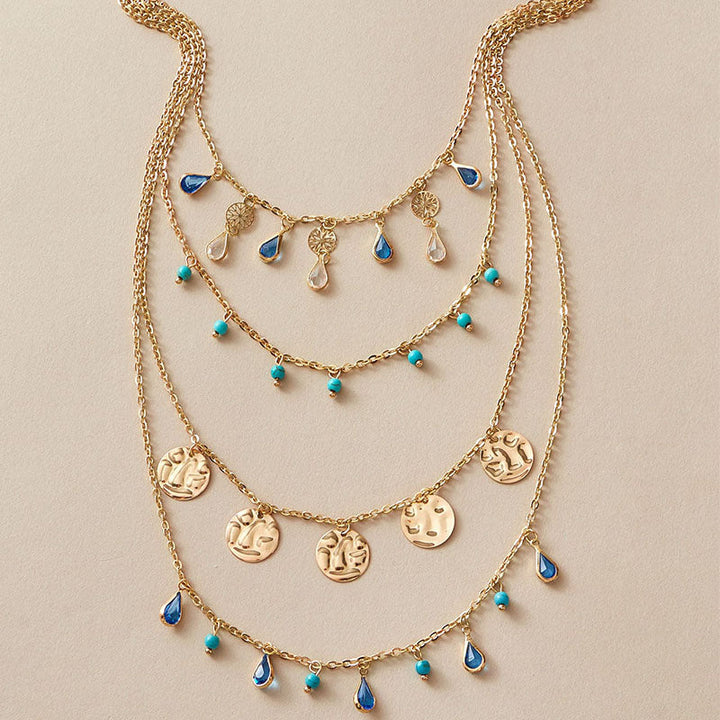 kvast Boho halskæde - guld disk og blå juvel lagdelt sæt